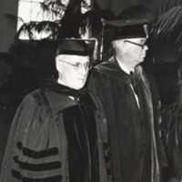 William Ezra Lingelbach, in cap and gown, 3/4 length, with unidentified man also wearing cap and gown.