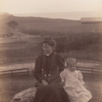 "Saddle Rock": Shryock child and mother [?], sitting, full length, informal portrait.