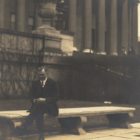 Joseph Russell Smith, seated outside on bench.