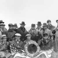 Group portrait of Nautilus crew on ice floe.