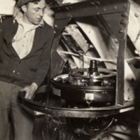 Frank Blumberg looking at gyro, on board the Nautilus.