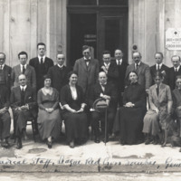 20 members of the Medical Staff, League Red Cross Societies, Geneva, informal group portrait, full length, 12 standing and 8 seated.