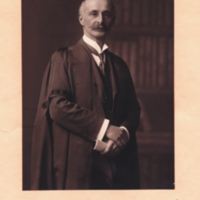 George H. F. Nuttall, 3/4 length, formal portrait, standing in collegiate robe.