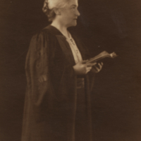 Martha Carey Thomas, profile, holding book.