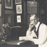 Harvey Cushing at desk with lab coat.