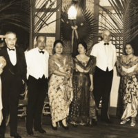 Victor George Heiser with eight faculty members, standing, full length,  at University of the Philippines reception, Manila.