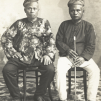 Dato Mastura (left) and his judge, Dato Kali (right), full length, formal, seated.