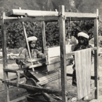 Two young girls working on loom, Benguet Province, Philippines.