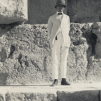 Heiser standing on stone ledge of pyramid.