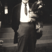 Roland Thaxter, holding dog, 1928.