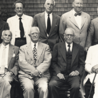 Ralph Lillie, Walter [Garvey], W. J. V. Osterhout, E. G. Couklin, Merkel Jacobs, A. P. [Mathlos], Robert F. Loeb, E. N. Harvey,  and G. H. Clowes formal, standing and seated at the Marine Biological Laboratory, Woods Hole.