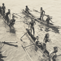 Moro boys and girls in boats surrounded by water.