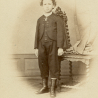 U4.1.19 Franz Boas, about age eight, standing, next to chair, c.1.