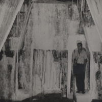 John Alden Mason, full length, standing in cave, Palenque, Mexico.