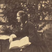 Mary Jane Peale, seated holding book.