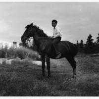 A-027: John Berens riding a horse