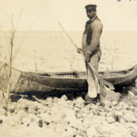 6-4-a: Man with canoe