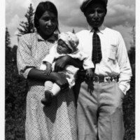 A-107: Ojibwa, Little Grand Rapids, Bazabak (John James) Keeper & wife Iskwe (Theresa) and baby Jean