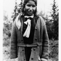 A-110: Ojibwa girl, portrait, standing outside 