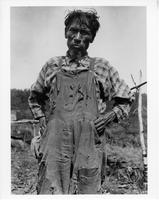 A-247: Ojibwa man, portrait, wearing overalls 