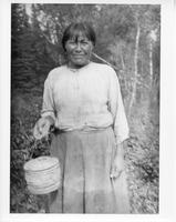 A-278: Ojibwa woman, portrait, holding basket 