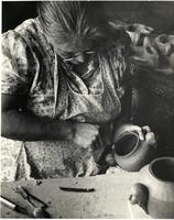 2-11-a: Maude Welsh working on mouth of a vessel 