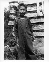 F-084: Ojibwa boy in overalls, portrait