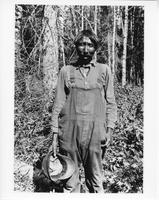 F-132: Ojibwa man holding hat, portrait 