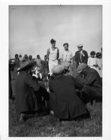 F-191: Ojibwa, Fishing Lake, Saskatchewan. Large group, four men playing drum. Three men standing.