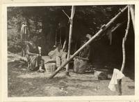 Camp of Algonquin birch-bark worker and basket maker, Madenine Cesar (far)