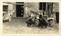 Harry Iselin and H.W. Crowhurst repairing car