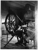 D089: Woman at spinning wheel, Rivière-à-Pierre