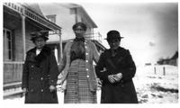 D102: Three women standing outside wearing formal hats, Mashteuiatsh