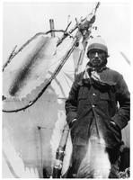 D117: Innu man in front of tent, Sheshatshiu, circa 1920s