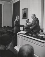 George F. Kennan shaking hands with APS President Owen J. Roberts