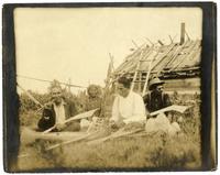 05: Ojibwe group seated near cabin