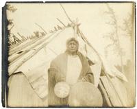 06: Ojibwe man holding drums