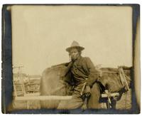 10: Ojibwe man learning against horse, Turtle Mountain