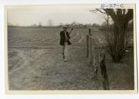 10-27-c: Joseph Pierite, Sr., playing with stickball sticks