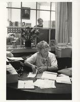 Mary Margeson at the front desk of Library Hall