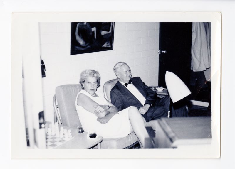 Rose Mooney-Slater seated on a couch with her husband John Clarke Slater.