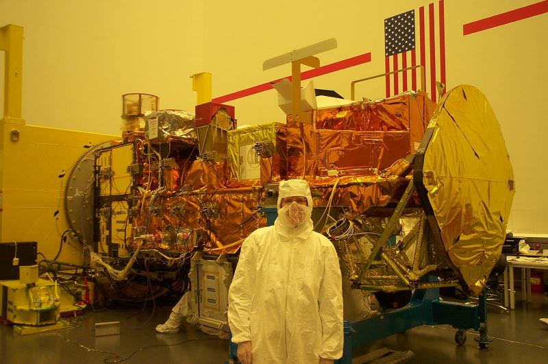 Claire Parkinson in a classroom with the satellite Aqua.