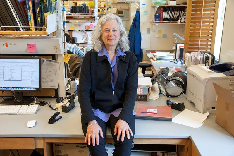 Judith Klinman seated in her lab.